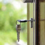 House keys in the front door of a new home