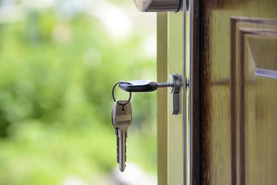 House keys in the front door of a new home