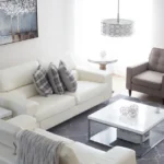 Bright staged living room with white sofa and modern decor