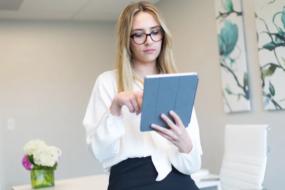 Woman reading articles on a tablet to check reliable information